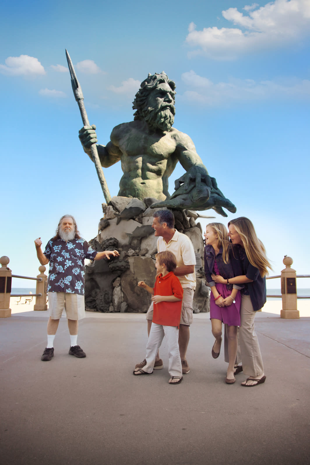 Kick off your vacation with King Neptune on the boardwalk Posing with King Neptune